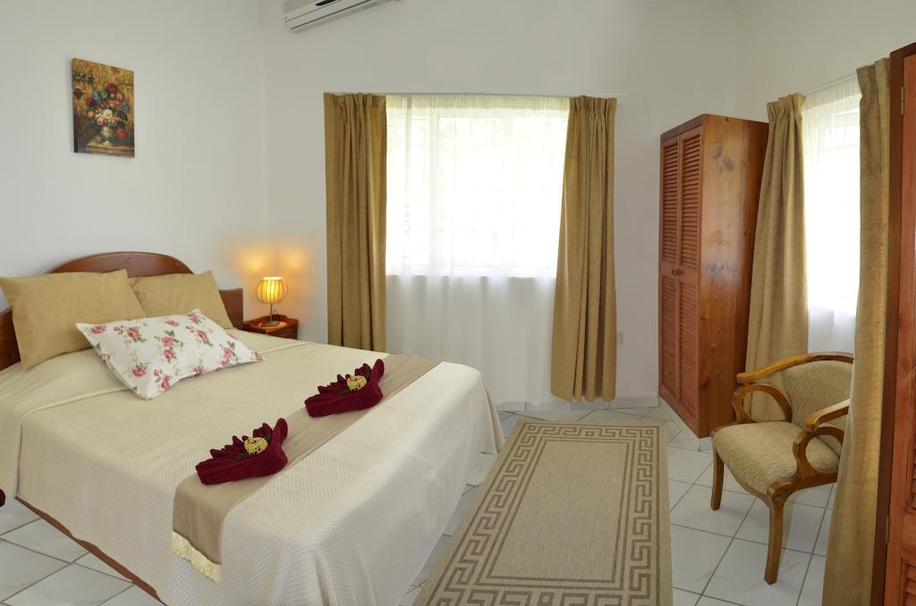 Ixora Villa Anse Royale Habitación foto