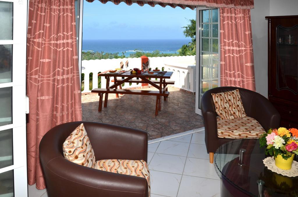 Ixora Villa Anse Royale Habitación foto