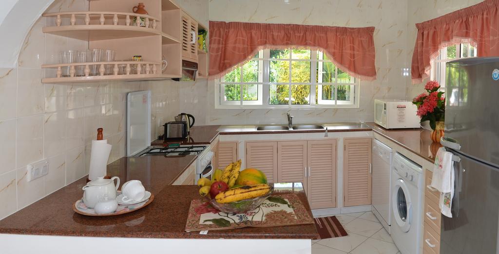 Ixora Villa Anse Royale Habitación foto